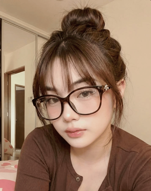 woman in white and black striped shirt